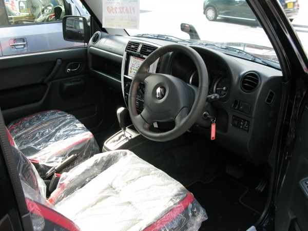 Suzuki Jimny cockpit. Rather simple, but it featured a button-activated part-time 4x4.