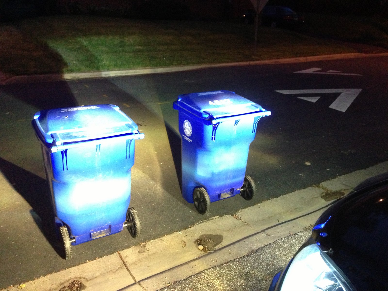 Fog beams aimed against twin trash bins for preliminary height matching.